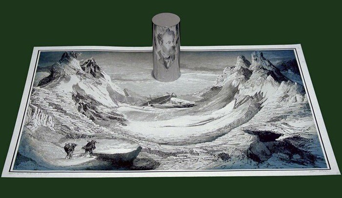A reflective cylinder on a distorted mountain landscape reconstructs part of the scene on its curved surface.