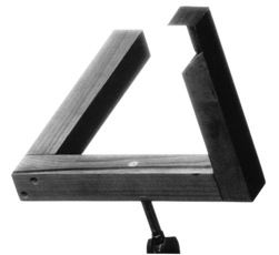 The same triangular sculpture viewed from an angle that reveals a gap between its beams.