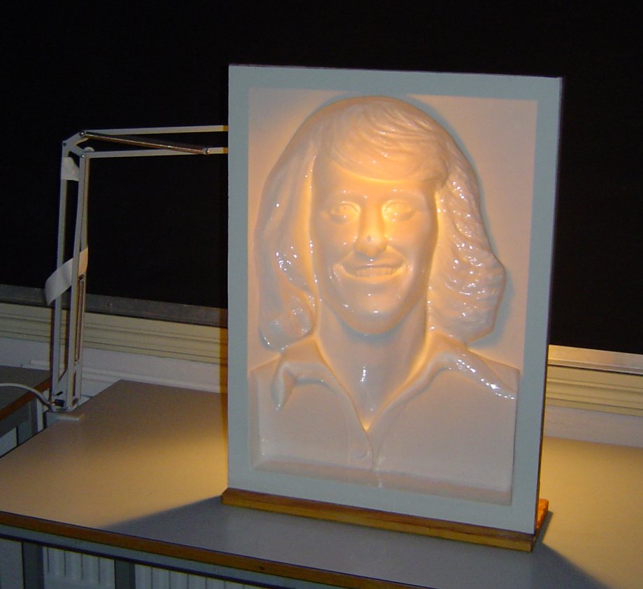 A concave mask photographed or animated to demonstrate apparent convexity.